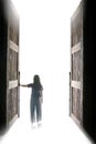 Woman walking into the light through open big door, to go to nirvana, every cloud has a silver lining, Royalty Free Stock Photo